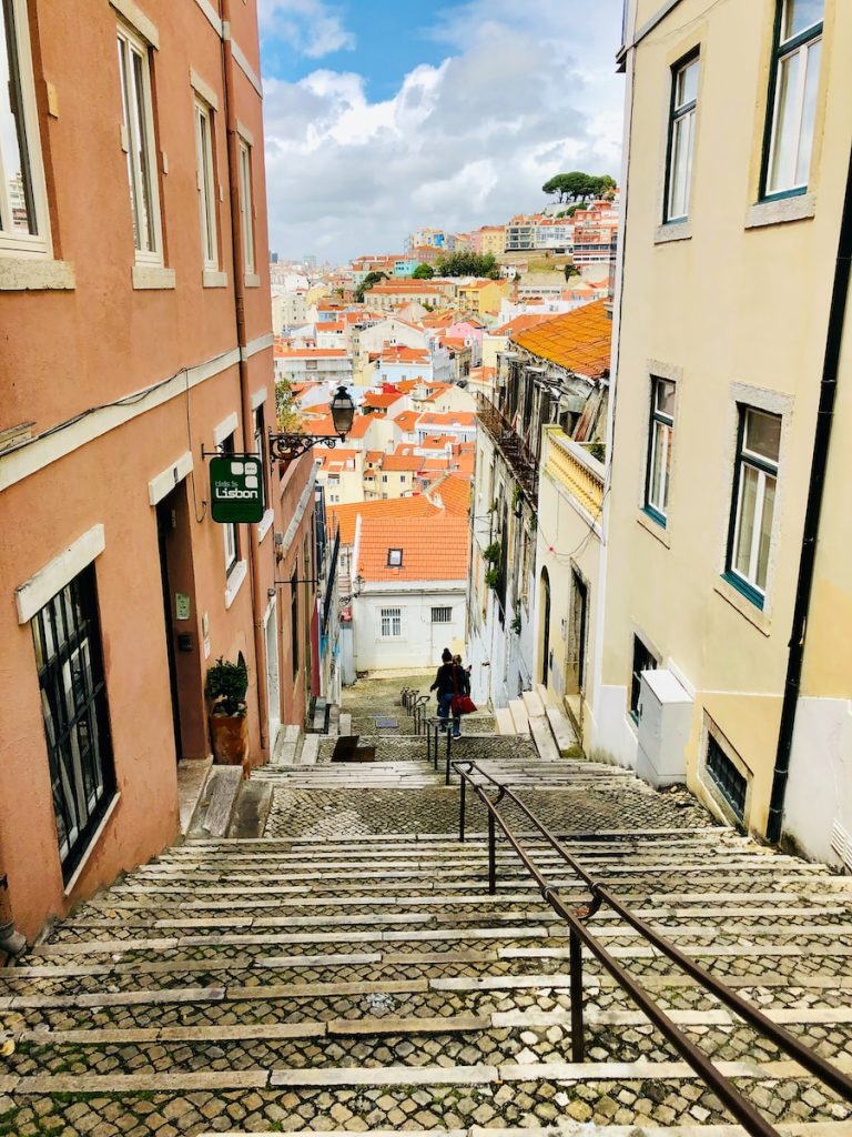 man standing on gray stair